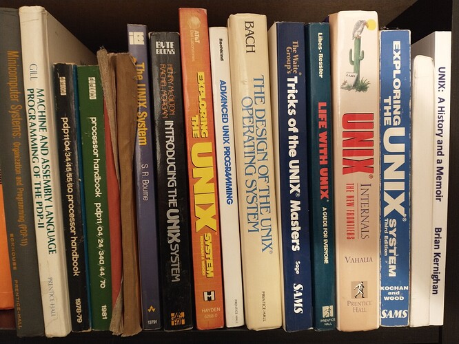 A short shelf of Unix books with about a dozen titles as described below.